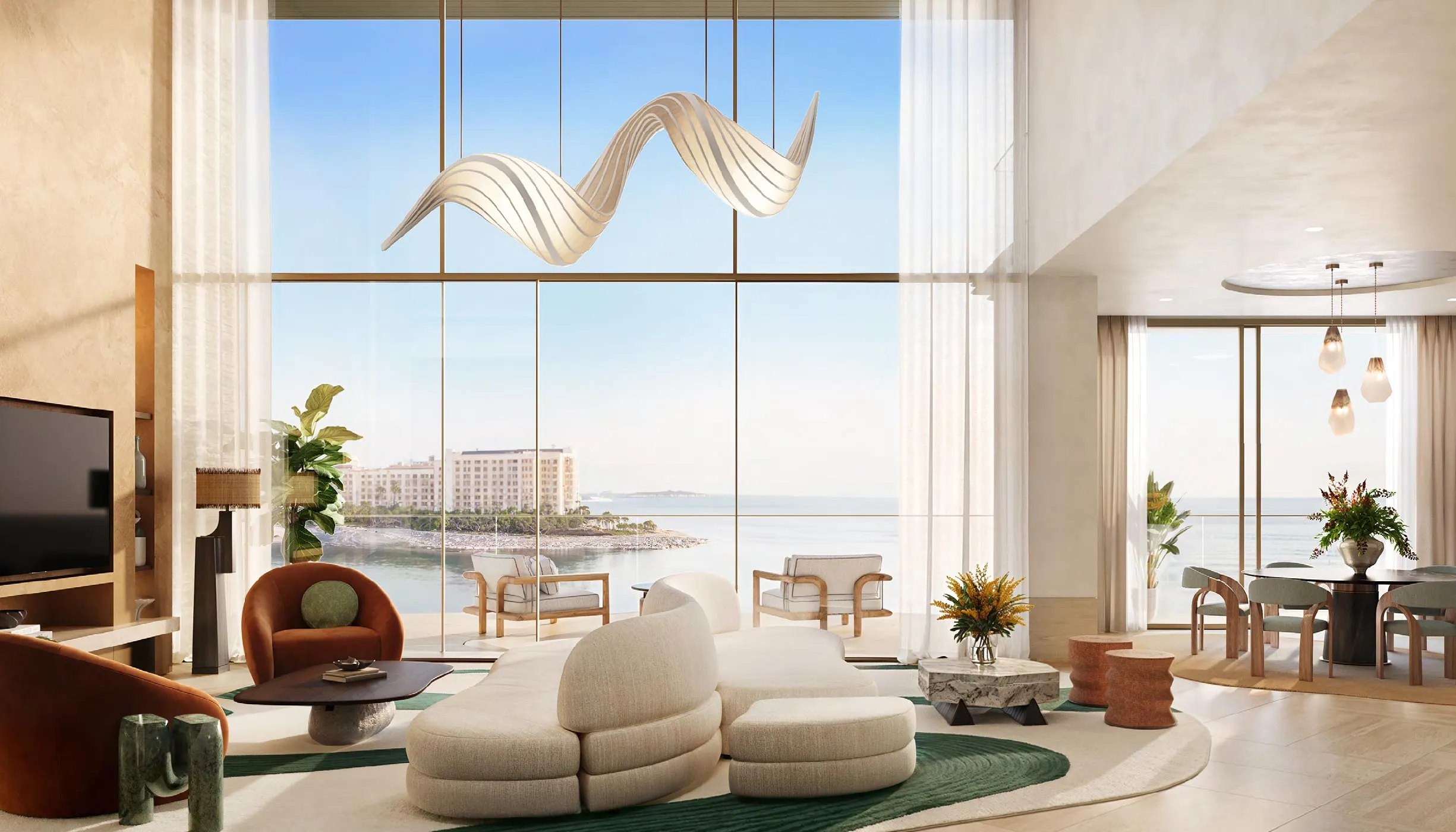 Double-height living space in a Solaya Duplex Residence facing the sea