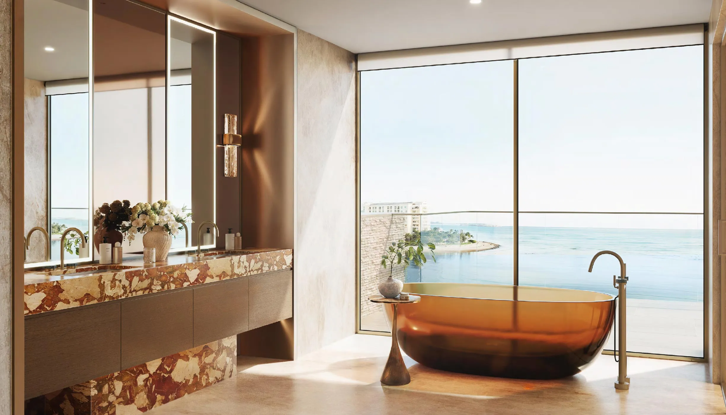 Solaya bathroom with stone vanity and freestanding bath facing the sea