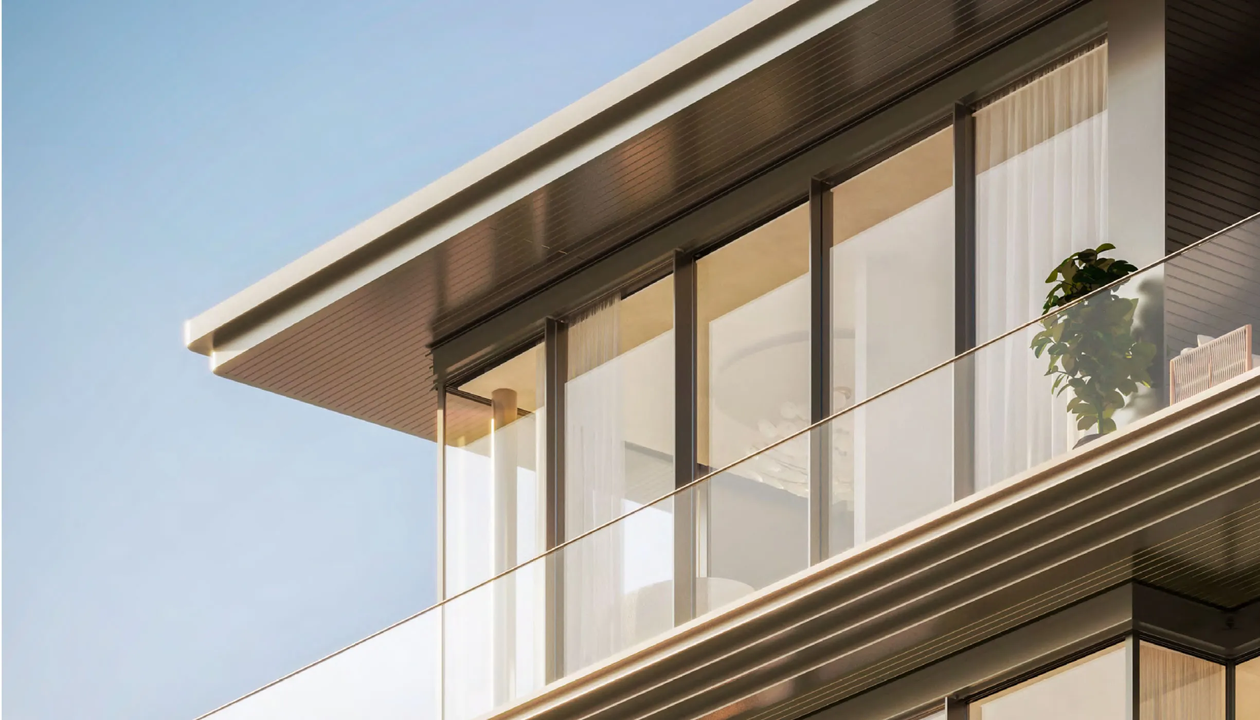 Detail of the Solaya facade with deep overhangs and glass balustrades